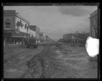 Main Street in Burbank, Calif. covered in debris from flooding caused by rainstorm, 1928