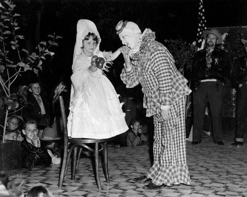 Fiesta, little girl and a clown