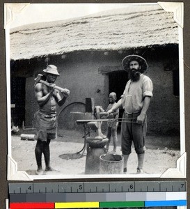 Father Sirlinger doing blacksmith work, Shendam, Nigeria, 1923