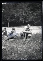 Soldiers sitting in field