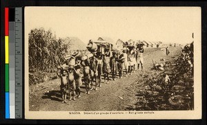 A group of porters leaving a village, Congo, ca.1920-1940