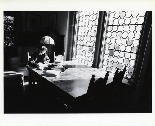 Student in Holbein Room of Denison Library, Scripps College