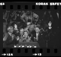 Ronald and Nancy Reagan at podium, waving at 1980 Republican National Convention in Detroit, Mich