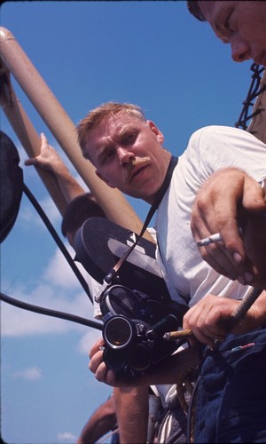 Cameraman aboard the USC&GS Pioneer during the International Indian Ocean Expedition. 1964