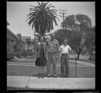 Dorothea (Siemsen) Burgess, Alfred Siemsen and Richard Siemsen pose on the walkway in front of H. H. West's home, Los Angeles, 1944