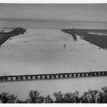 Aerial view of the 1955 flood showing the Sacramento River at flood stage as it crosses the Fremont Weir, which is part of the Yolo Bypass Flood Control system