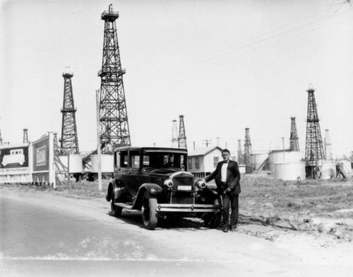 Automobile in the midst of an oil field