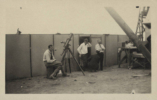 Edwin Powell Hubble seated at a small telescope, Point Loma