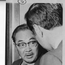 Dr. S.I. Hayakawa chats with a legislator, possibly State Senator George R. Moscone