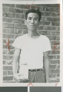 A Korean Man Holds a Jar of Milk, Seoul, South Korea, 1965