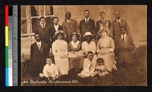 Missionary conference members assembled outside a building, Angola, ca.1920