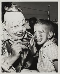 Paul Sharp gets a clown face at the Sonoma County Fair Carnival, Santa Rosa, California, 1957
