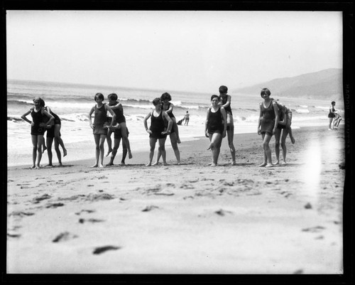 Scouts playing on the beach at Santa Monica Girl Scout camp