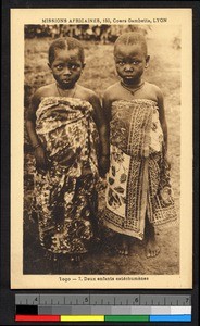 Two young girls pose outdoors, Togo, Africa, ca. 1920-1940