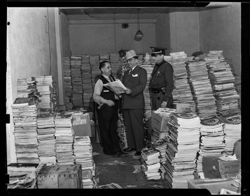 Los Angeles County Sheriff Eugene W. Biscailuz with banned magazines