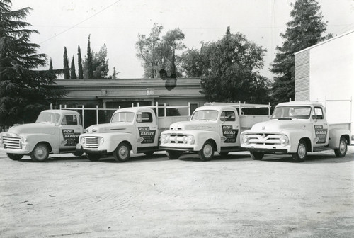 Fleet of four company trucks for the Rich and Barber Hardware Store in Banning, California