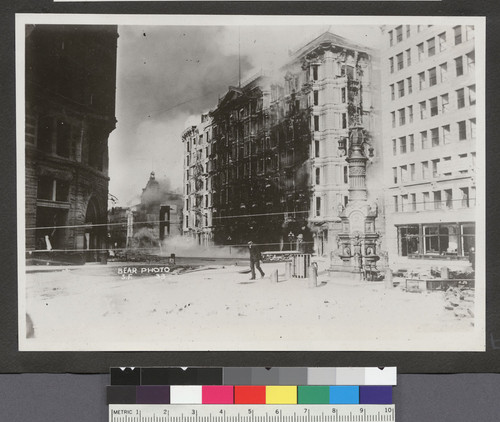 [Corner of Kearny, Geary, and Market Sts. During burning of Palace Hotel, center. Lotta's Fountain, right.]