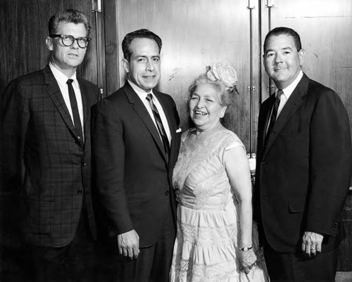 Consuelo Bonzo with three men