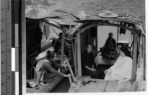 Maryknoll Sister Mary Lou Martin traveling sitting on a boat with women, Wuchow, China, ca. 1949