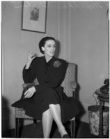 Portrait of dancer and choreographer Martha Graham sitting in a chair, Los Angeles, circa 1940