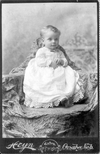 Young child in white gown
