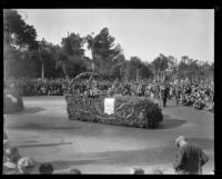 Automobile carrying Liutenant Governor H. L. Carnahan and Tournament of Roses President C. Hal Reynolds in the Tournament of Roses Parade, Pasadena, 1930