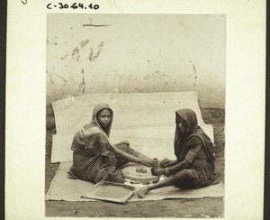 Grinding indian corn (millet). India