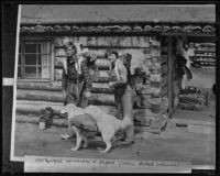 William H. Albee, wife Ruth, and dog in front of cabin [copy photograph 1935], British Columbia, 1930