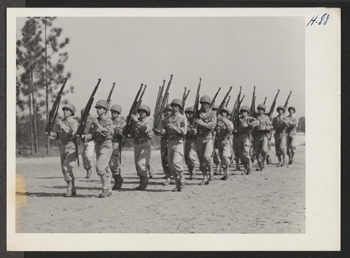 Right Shoulder Arms. A squad of Japanese-American soldiers are here shown in the action of obeying this command during routine