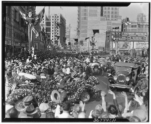 Crowd celebrating at a parade for Charles Lindbergh near the Chamber of Commerce building on September 20, 1927