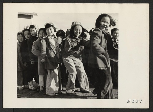 A cold December afternoon doesn't dampen the spirits of these primary school girls as they compete in a racing game with the primary boys. Photographer: Parker, Tom Amache, Colorado