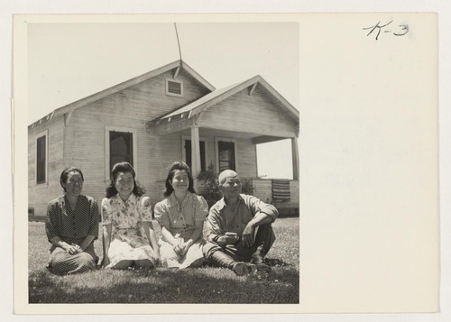 The Shimada family and their home at Rt.1, Box 366A, Acampo, California. Left to right, Mrs. Yonezo Shimada, Sally, Mae