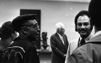 Jesse Fuller speaking with tv host and newsman Ray Taliaferro (right) after his concert at the Oakland Museum