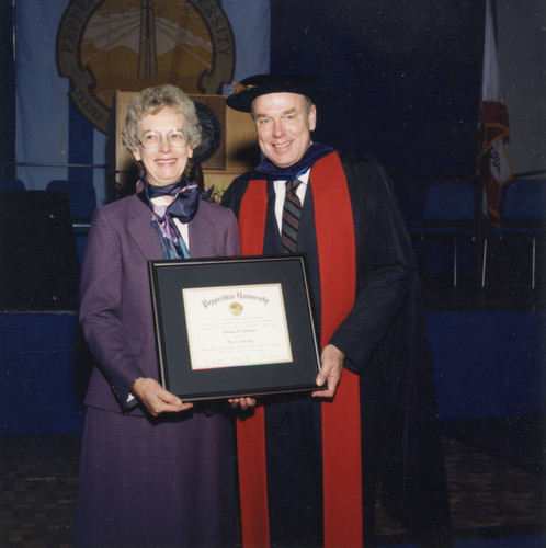 Thomas Everhart, holding his award, and his wife