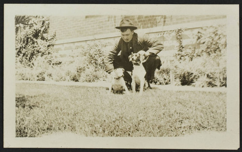 Unidentified personnel and two dogs in front of old Station No. 1