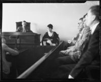 Zelda Smith on witness stand, with Coroner Frank Nance and jury, at arraignment of Harold Wolcott for the Pasadena murder of Helen Bendowski, 1933