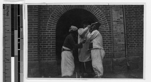 Maryknoll Sister providing medical treatment, Gishu, Korea, ca. 1920-1940