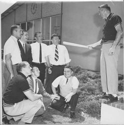 George Gillmore, Varsity Basketball Coach wielding a bat with other high school coaches, Petaluma, California, 1963