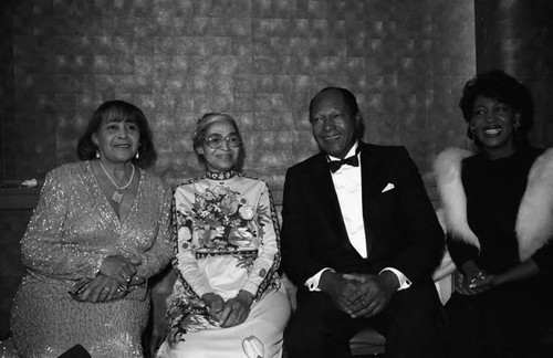 Rosa Parks, Tom and Ethel Bradley, and Maxine Waters posing together during a Black Wormen's Forum event, Los Angeles, 1989
