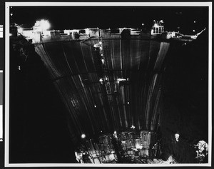 Construction of Boulder Dam at night, ca.1930