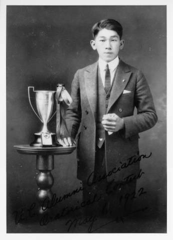 Walter Tsukamoto with a trophy from an oratorical competition at Sacramento High School