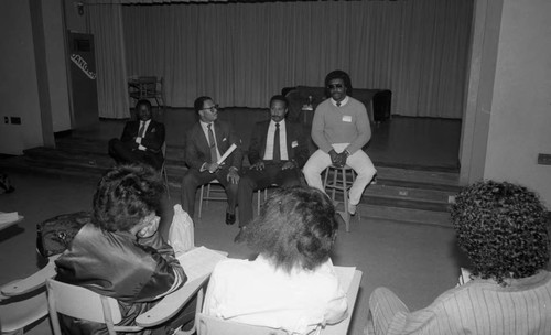 Men speaking to students during Career Day at Crenshaw High School, Los Angeles, 1985