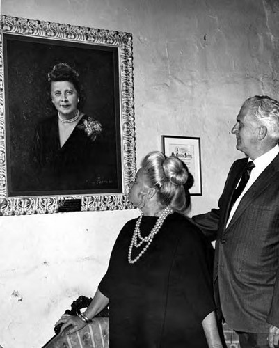 June and Jack Parks looking at portrait of Christine Sterling