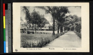 Tree-lined path before mission buildings, Congo, ca.1920-1940