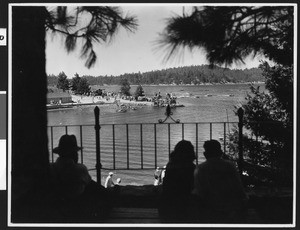 View from a balcony of motorboat racing on a lake, ca.1930