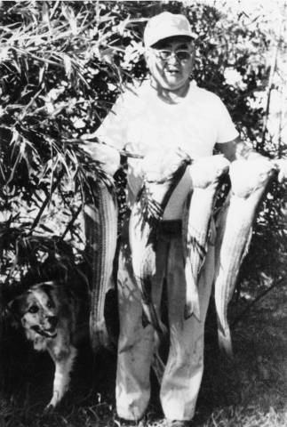 Kuzu Tsukamoto with fish and dog