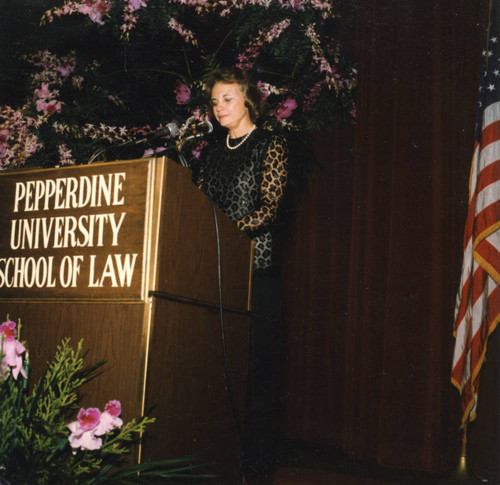 Lady speaker at the podium (Color)