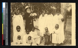 Missionary priest with women and children, Fianarantsoa, Faritanin' i, Madagascar, ca.1900-1930