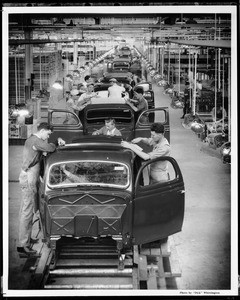 Interior view of the assembly line at the Ford Motor Company plant in Long Beach, ca.1936