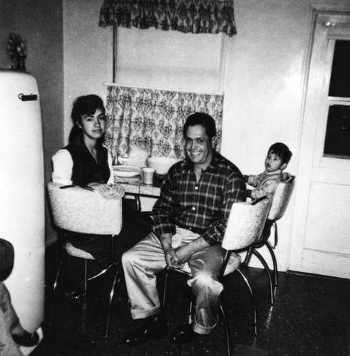 Mexican American family at kitchen table